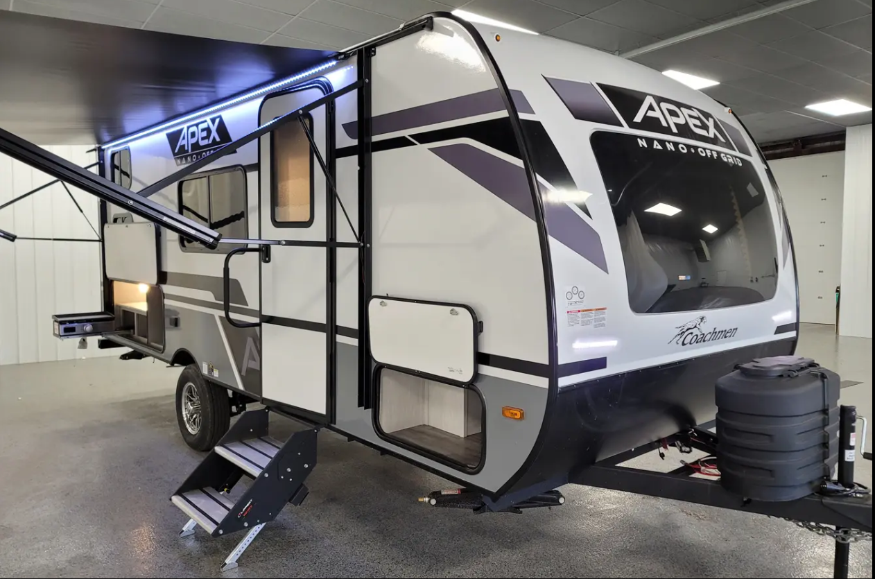 Inside of a 2020 Coachmen Apex 193BHS travel trailer with a kitchen to the left, table to the right, and bedroom in the back.
